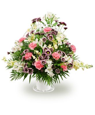 Mixed flowers in a handled basket